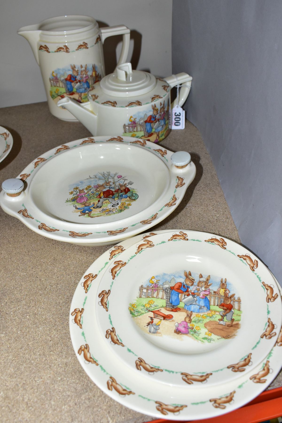 FIVE PIECES OF ROYAL DOULTON BUNNYKINS EARTHENWARE TABLEWARE, designed by Walter Hayward after