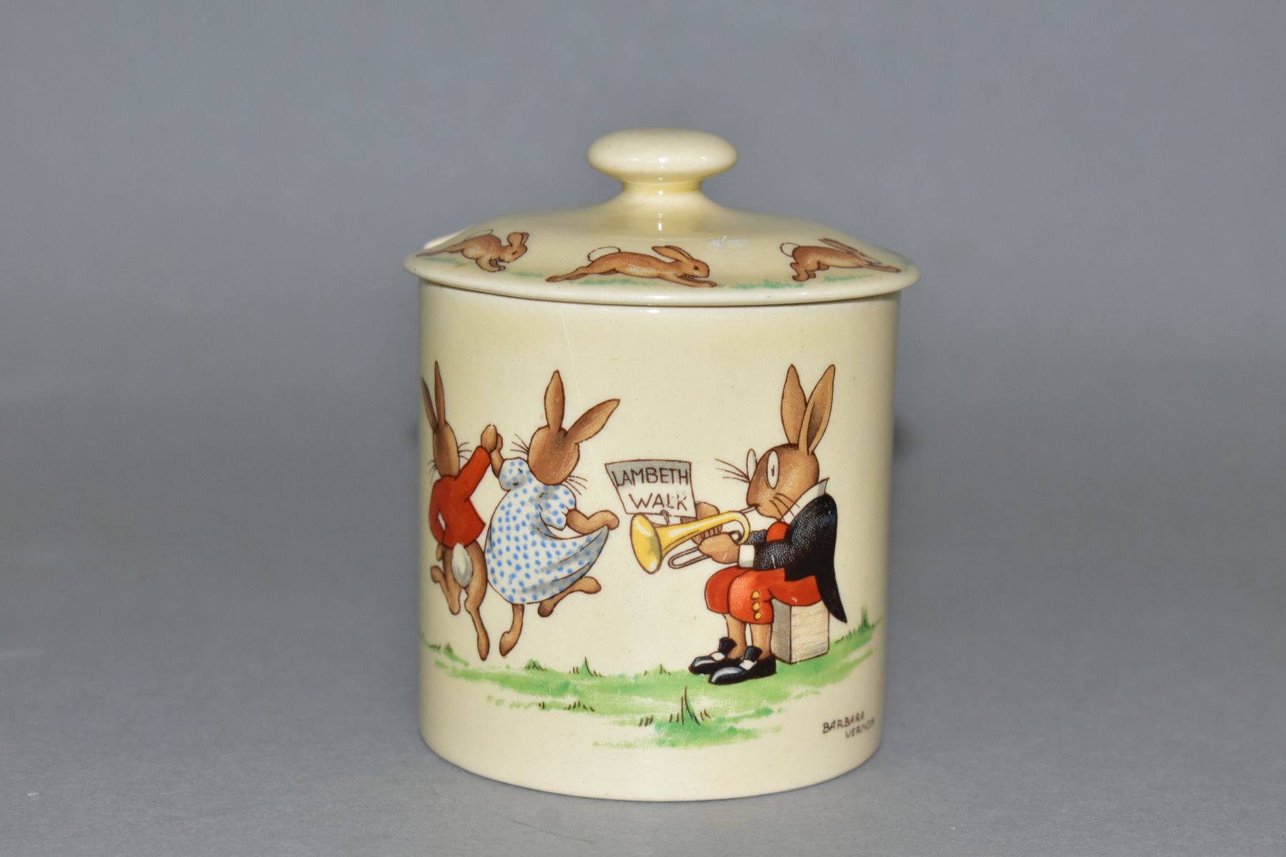 A ROYAL DOULTON BUNNYKINS EARTHENWARE JAM POT, Lambeth Walk, HW16, first version designed by Barbara