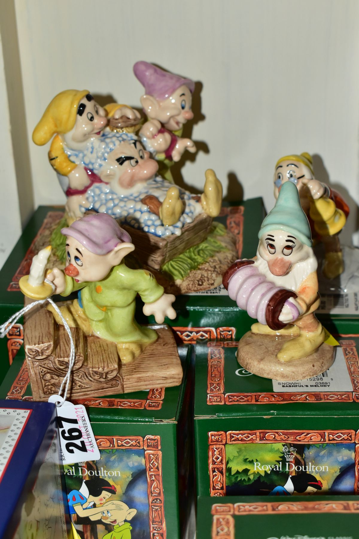 FOUR BOXED ROYAL DOULTON FIGURES FROM SNOW WHITE AND THE SEVEN DWARFS, comprising Dopey by