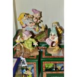 FOUR BOXED ROYAL DOULTON FIGURES FROM SNOW WHITE AND THE SEVEN DWARFS, comprising Dopey by