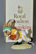 A ROYAL DOULTON TOUCHDOWN BUNNYKINS DB99, sixth variation (Notre Dame College), green and yellow, in