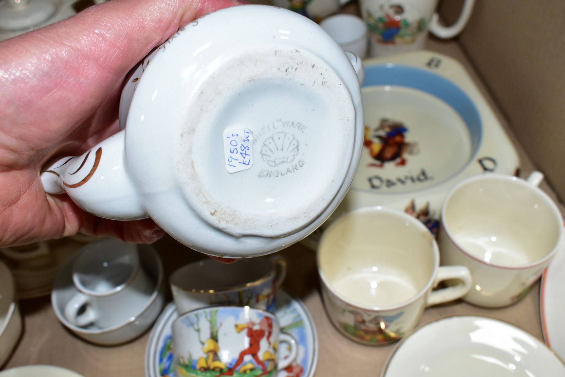 A BOX OF ASSORTED CHILDRENS CERAMIC TEAWARES, etc, including a Foley China mug printed and tinted - Image 7 of 8