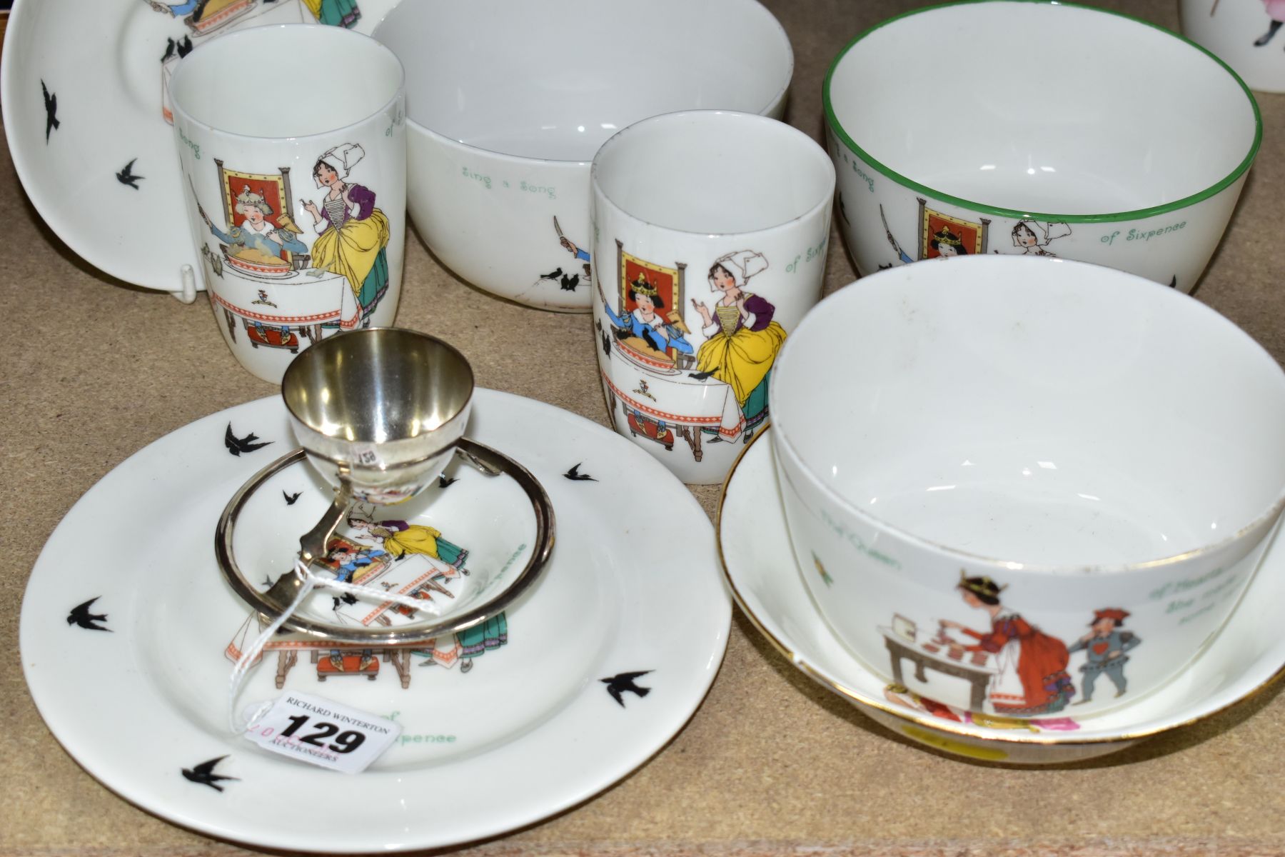 NINE PIECES OF ROYAL DOULTON CHINA NURSERY RHYMES SERIES WARE DESIGNED BY WILLIAM SAVAGE COOPER