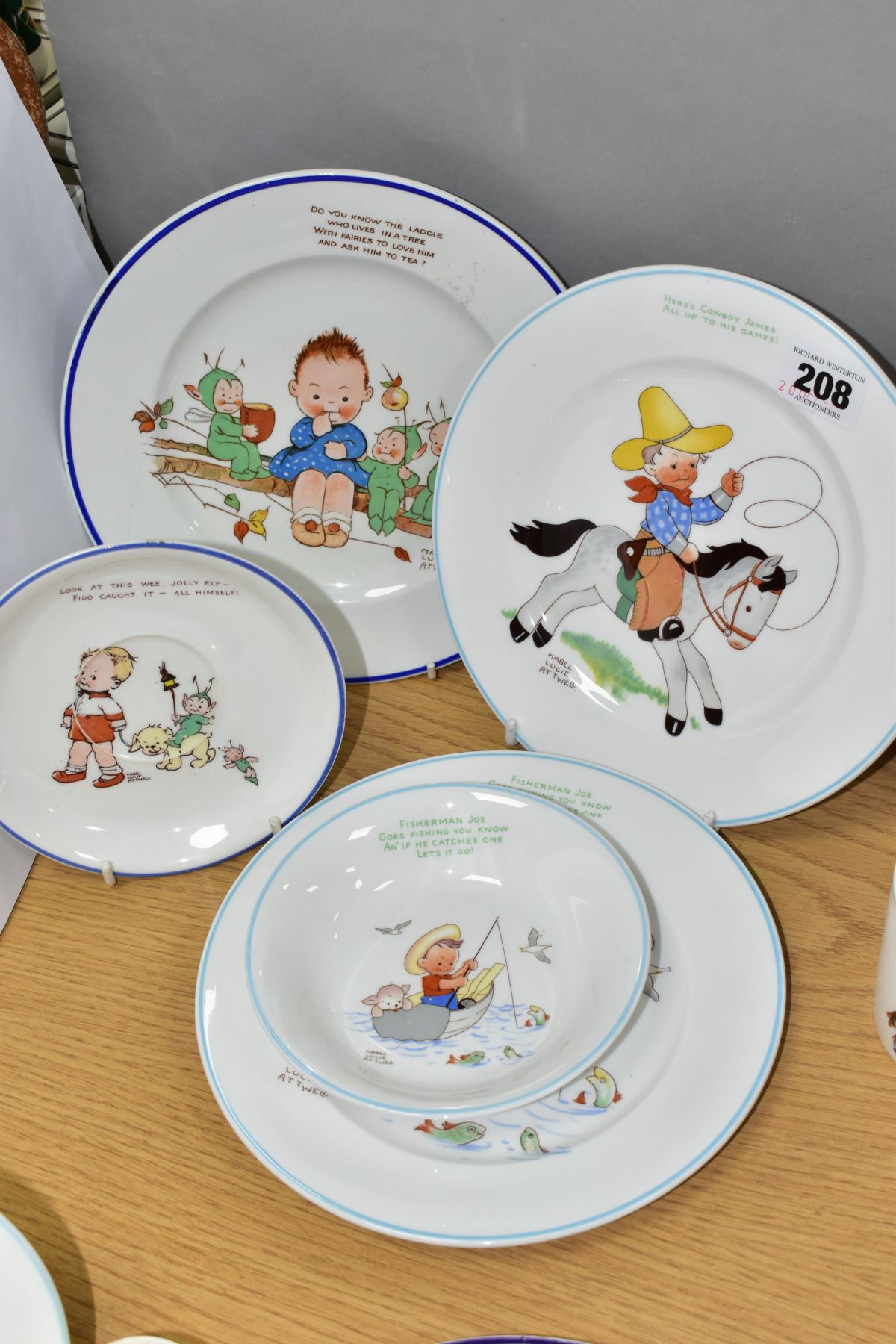 SHELLEY MABEL LUCIE ATTWELL NURSERY WARES comprising a Fisherman Joe 20cm plate and bowl, Cowboy