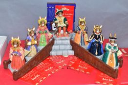 A SET OF EIGHT BOXED ROYAL DOULTON BUNNYKINS FIGURES AND STAND FROM THE TUDOR COLLECTION, comprising