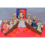 A SET OF EIGHT BOXED ROYAL DOULTON BUNNYKINS FIGURES AND STAND FROM THE TUDOR COLLECTION, comprising