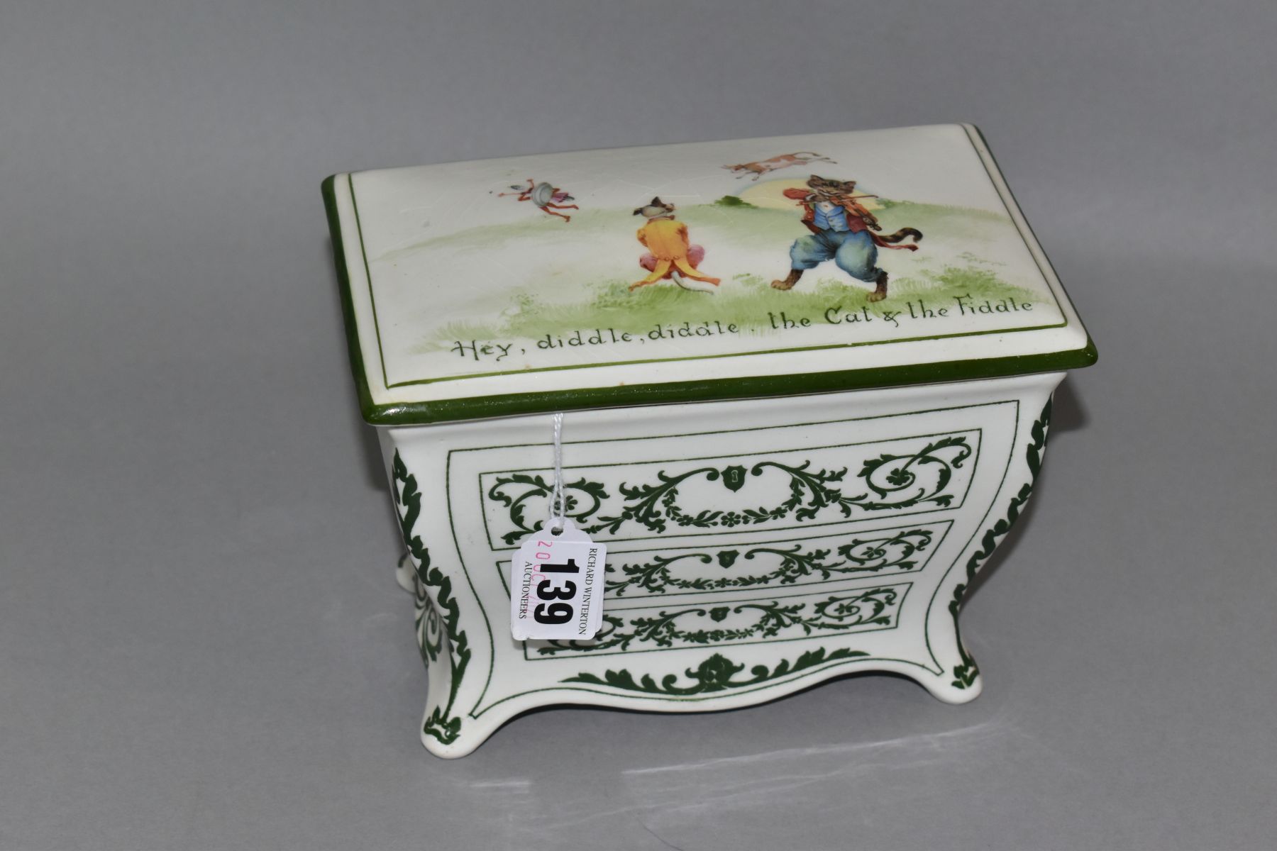 A ROYAL DOULTON NURSERY RHYMES 'A' SERIES WARE HUNTLEY & PALMERS BISCUIT CASKET IN THE FORM OF A