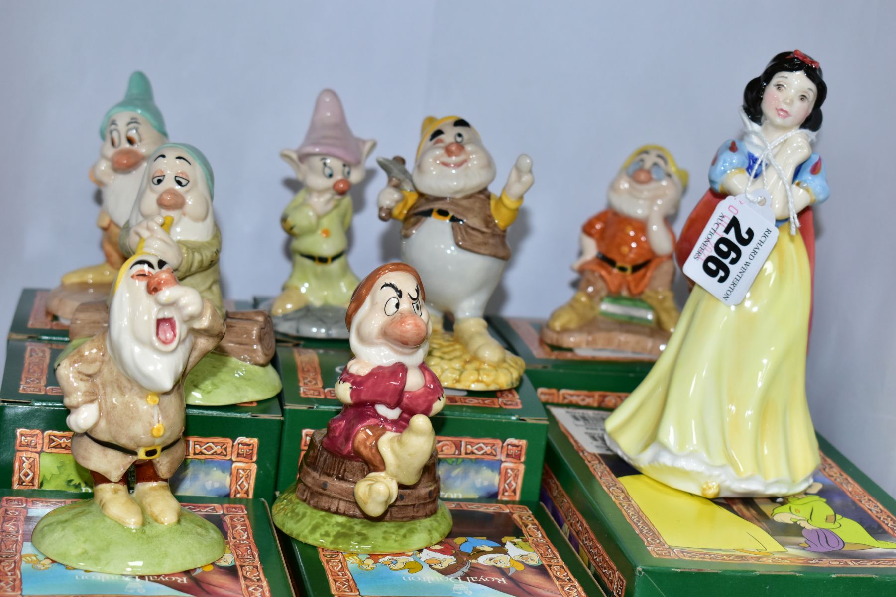 EIGHT BOXED ROYAL DOULTON FIGURES FROM SNOW WHITE AND THE SEVEN DWARFS, comprising Snow White SW9,