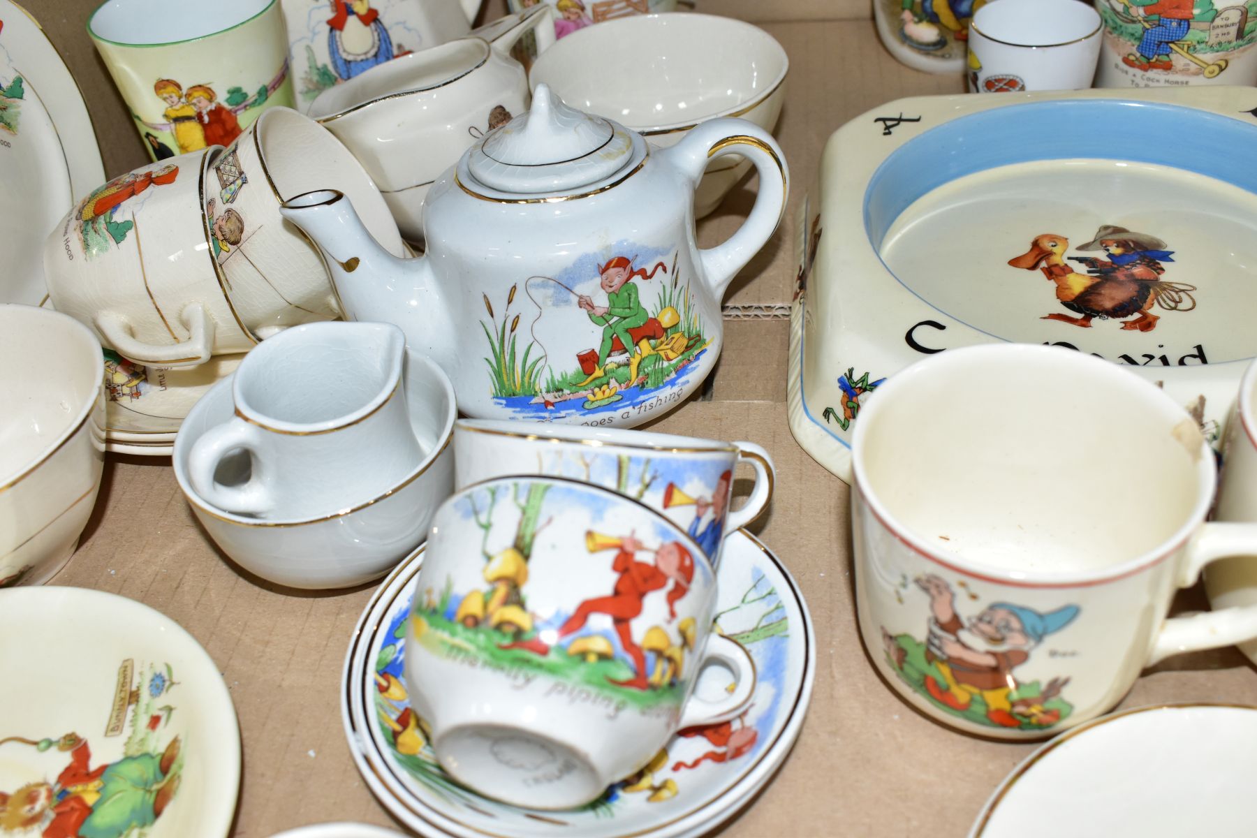 A BOX OF ASSORTED CHILDRENS CERAMIC TEAWARES, etc, including a Foley China mug printed and tinted - Image 6 of 8