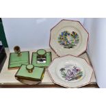A PAIR OF MID 19TH CENTURY EARTHENWARE OCTAGONAL CHILDRENS PLATES, moulded borders, centres