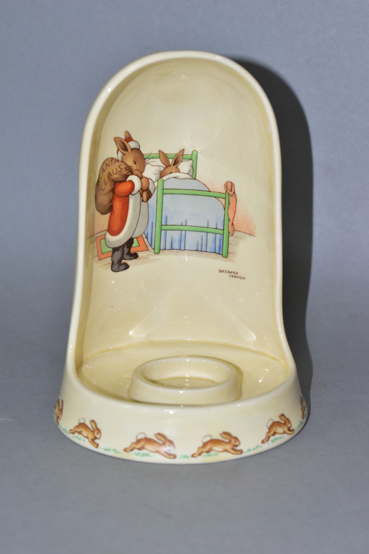 A ROYAL DOULTON BUNNYKINS EARTHENWARE CANDLE HOLDER, designed by Barbara Vernon, Santa Claus SF9 and