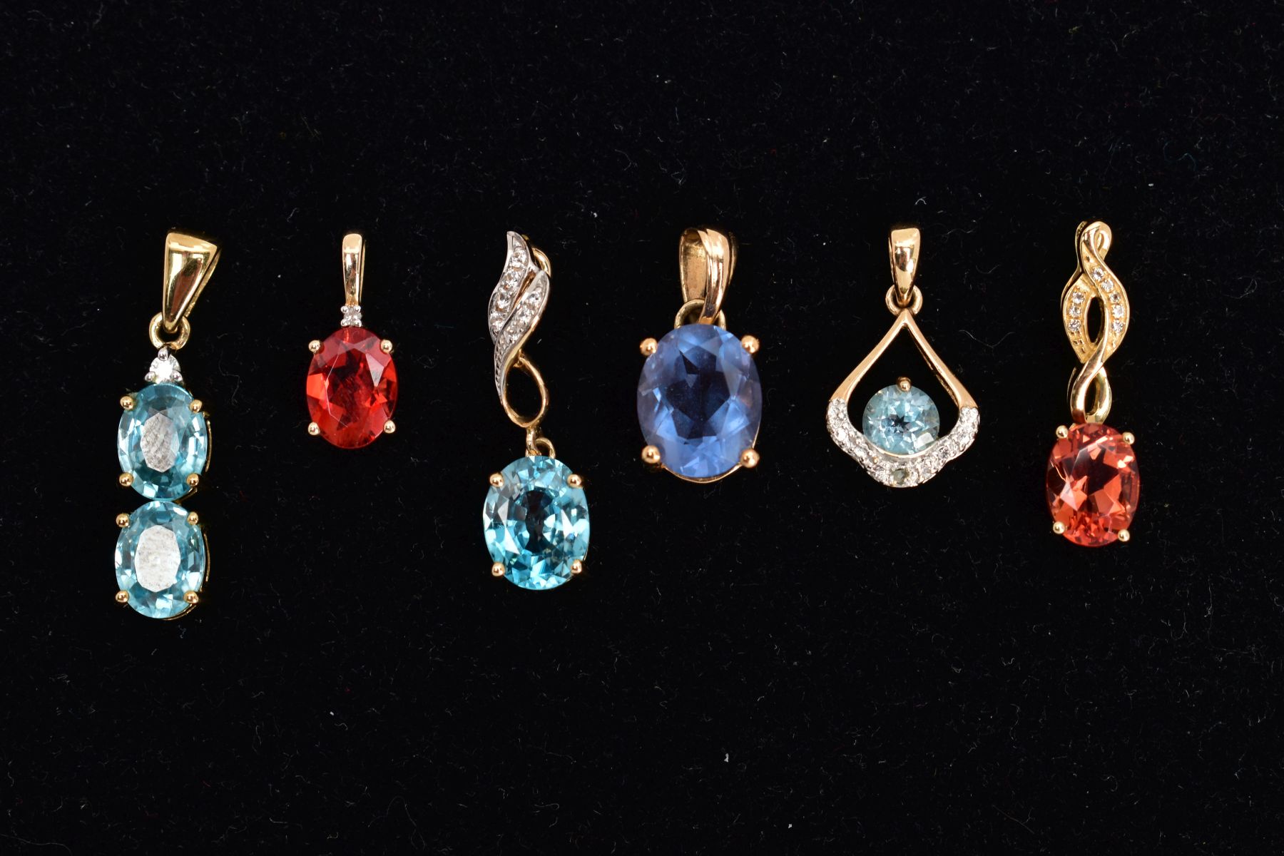 FIVE GEM SET YELLOW METAL PENDANTS, the first set with two oval cut blue topaz, fitted with a - Image 2 of 2