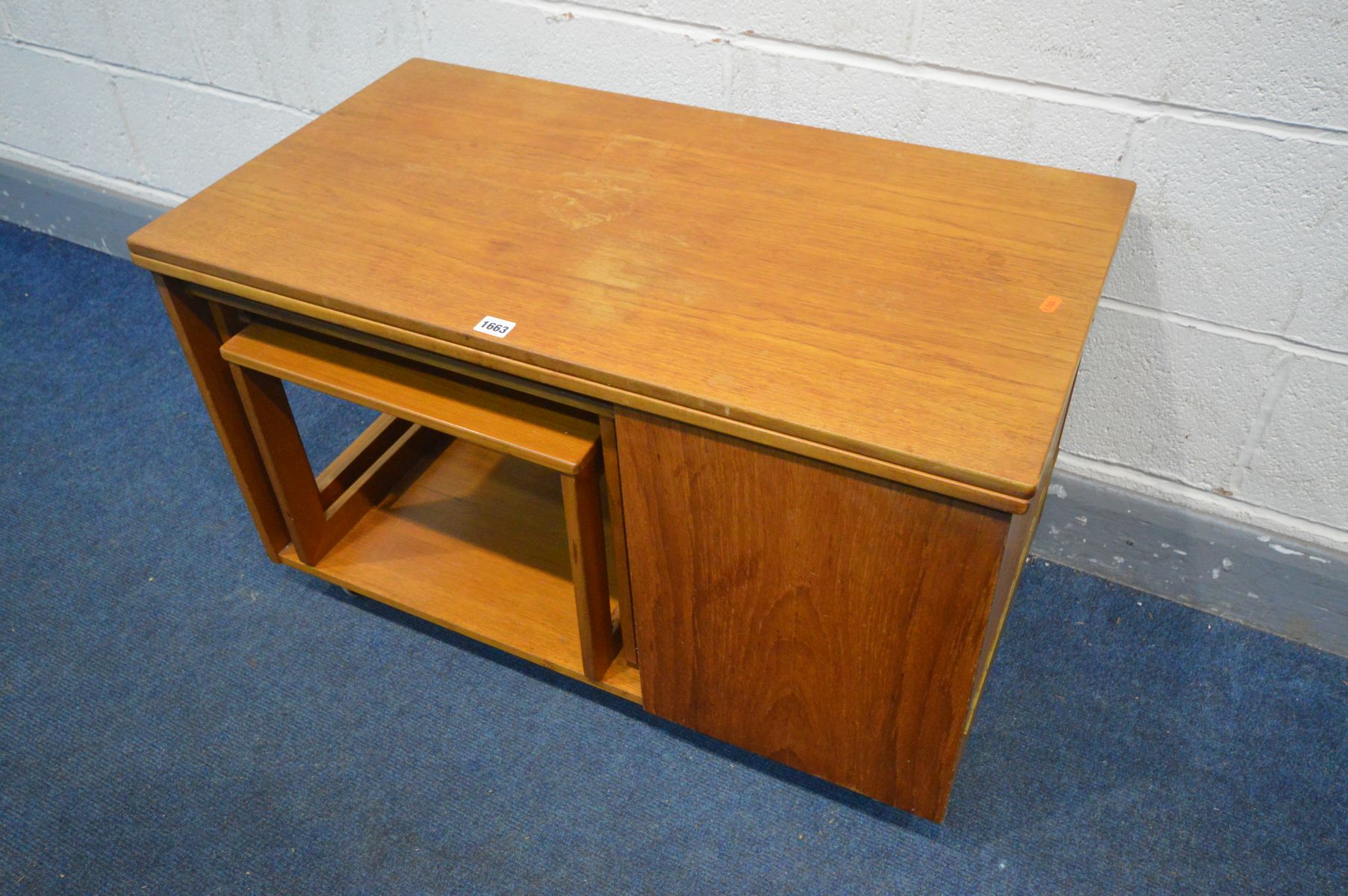 A TEAK COFFEE TABLE, with a rotating and fold over top, nest of two tables stored below and a fall - Image 3 of 4