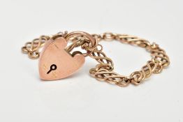 A 9CT GOLD BRACELET WITH HEART PADLOCK CLASP, the fancy link bracelet with heart padlock clasp,