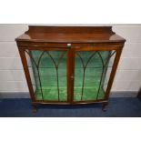 AN EARLY 20TH CENTURY OAK CHINA CABINET, with raised back, two double glazed doors enclosing two