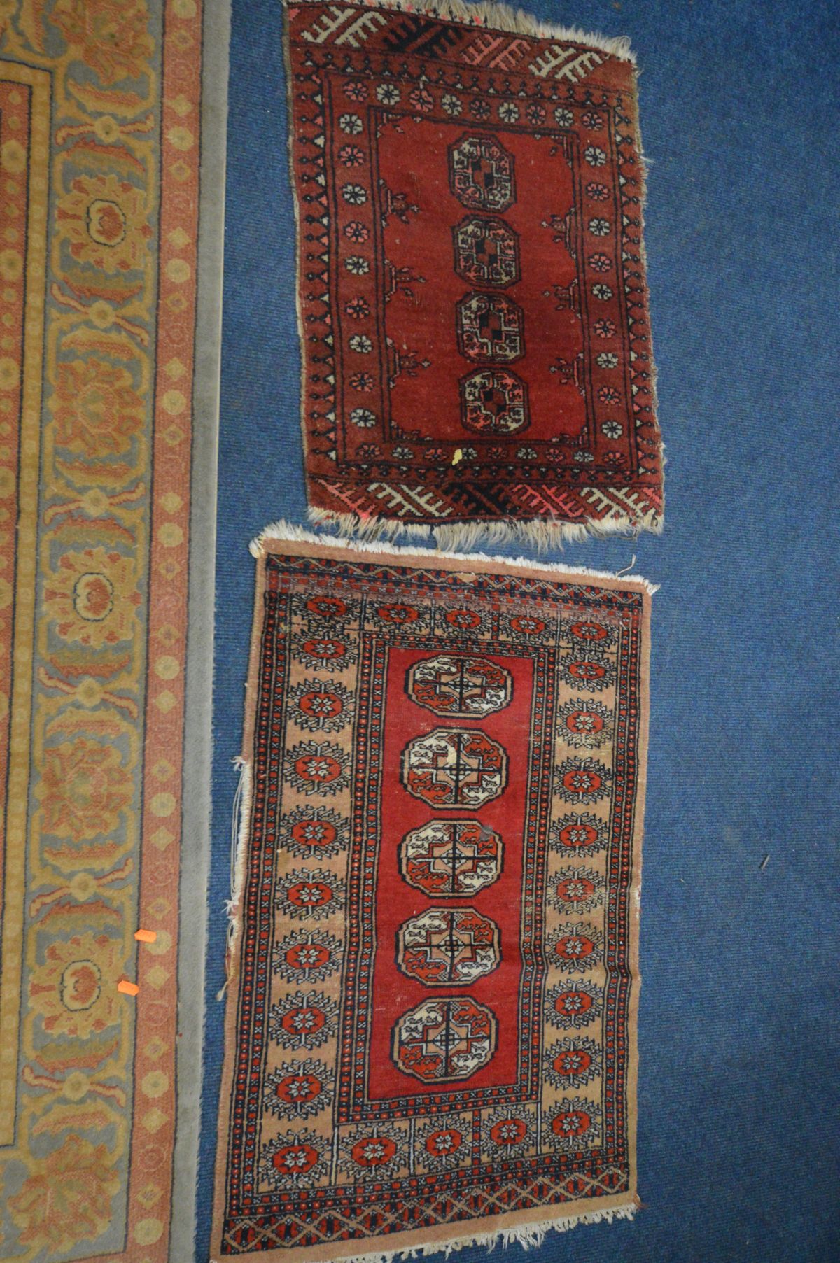 A FLORAL WOOLLEN RUG, labelled Abbey, 240cm x 170cm and two small tekke rugs, in a red field (3) - Image 4 of 4