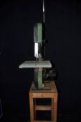 A REXON BS10SA BANDSAW on wooden stand (PAT pass and working)