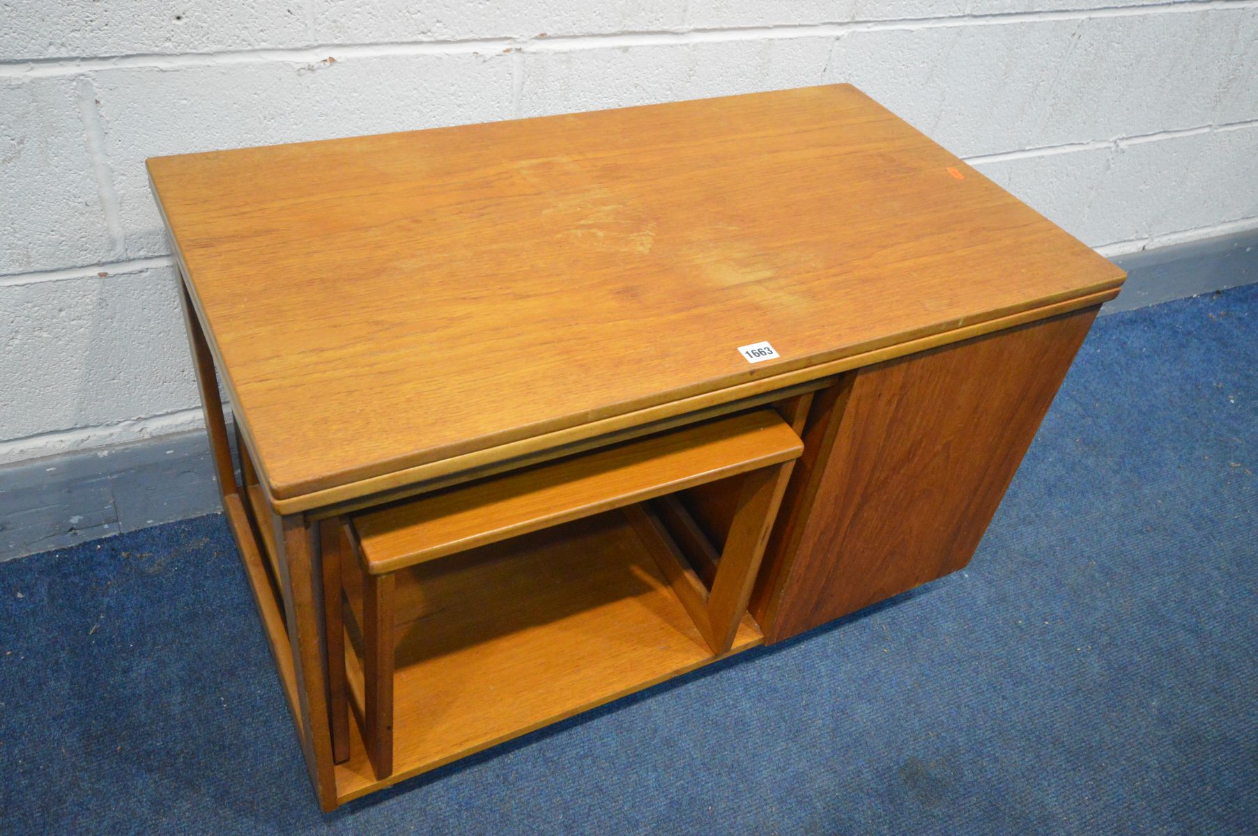 A TEAK COFFEE TABLE, with a rotating and fold over top, nest of two tables stored below and a fall - Image 2 of 4