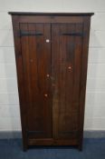 AN EARLY 20TH CENTURY SLATTED TWO DOOR CUPBOARD, width 96cm x depth 31cm x height 191cm - this lot