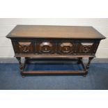 AN EARLY 20TH CENTURY OAK SIDEBOARD, two geometric fronted drawers, on a box stretcher, width