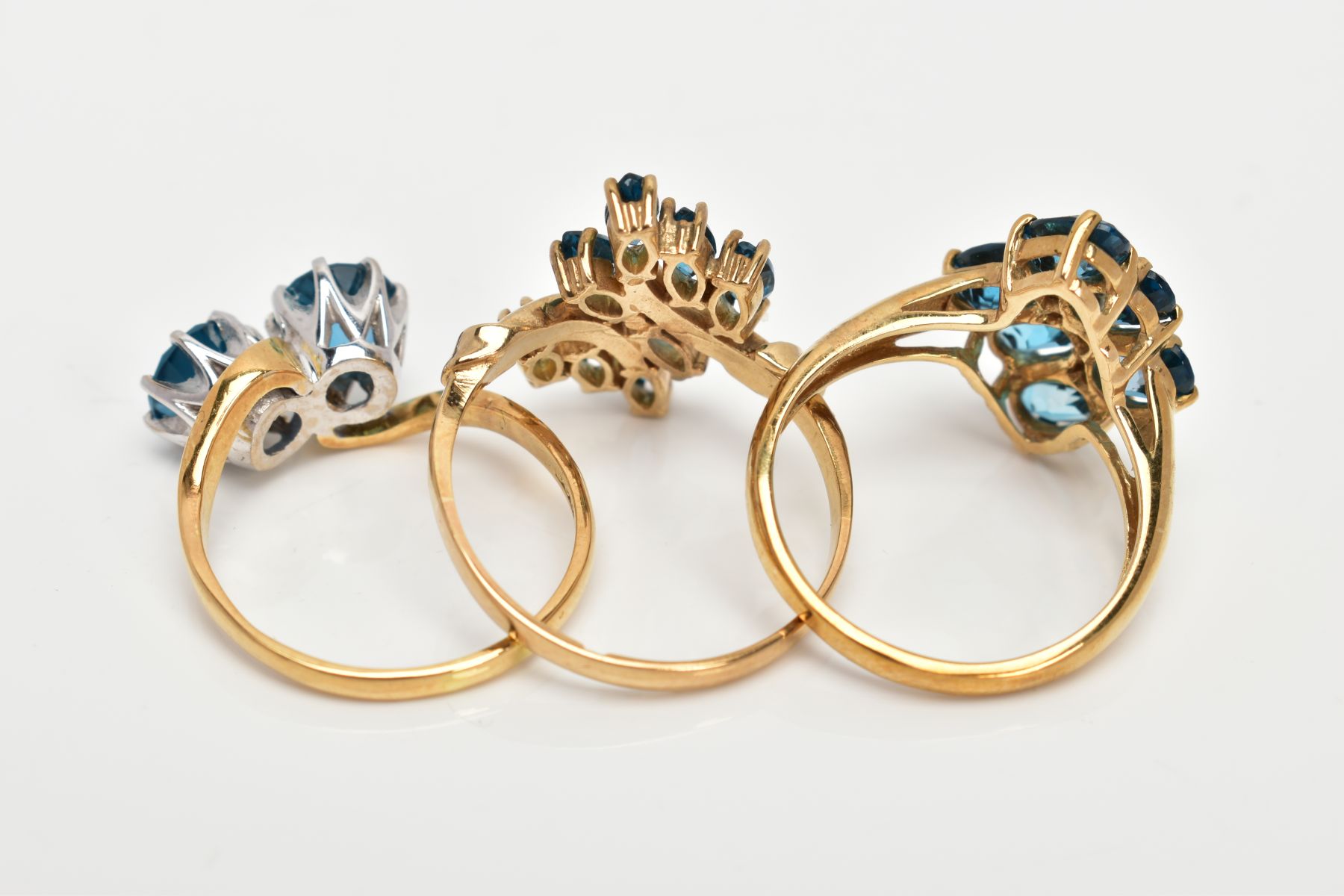 THREE TOPAZ DRESS RINGS, the first of a crossover style, set with two circular cut blue topaz, - Image 3 of 3