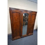 A VICTORIAN MAHOGANY COMPACTUM WARDROBE, with a single cupboard door besides to other doors