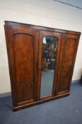 A VICTORIAN MAHOGANY COMPACTUM WARDROBE, with a single cupboard door besides to other doors