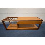 A MID 20TH CENTURY TEAK MULTI PURPOSE COFFEE TABLE, with a single drawer, shelving and a spindled