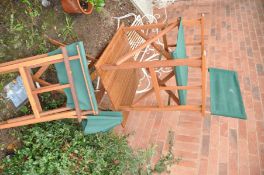 A MODERN HARDWOOD FOLDING GARDEN TABLE, 60cm square and a pair of directors chairs (3)