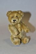 AN UNMARKED TEDDY BEAR PERFUME BOTTLE, possibly Schuco jointed golden mohair body with removable