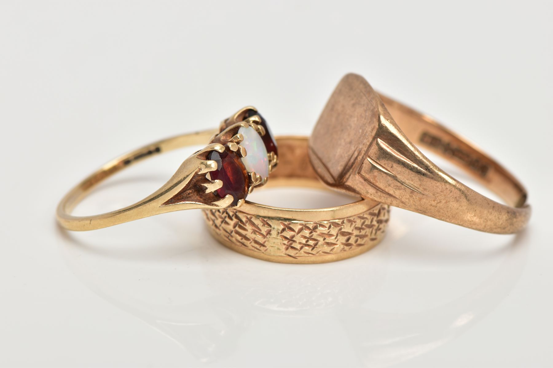 THREE 9CT GOLD RINGS, the first a textured band, hallmarked 9ct gold possibly London, ring size L, - Image 2 of 4