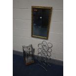 A METAL AND WICKER UMBRELLA STAND, a metal wine rack, and a gilt frame wall mirror (3)