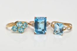 THREE 9CT GOLD TOPAZ DRESS RINGS, the first designed with a rectangular cut blue topaz, flanked with