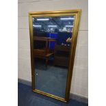 A LARGE MODERN GILT WOOD FRAMED BEVELLED EDGE FLOOR STANDING MIRROR, 182cm x 93cm