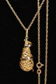 A 9CT GOLD PENDANT NECKLACE, the pendant of an openwork tear drop shape, with a plain polished