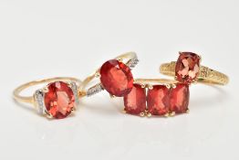 FOUR 9CT GOLD GEM SET RINGS, each set with orangish red stones possibly organ sunstone/Andesine,