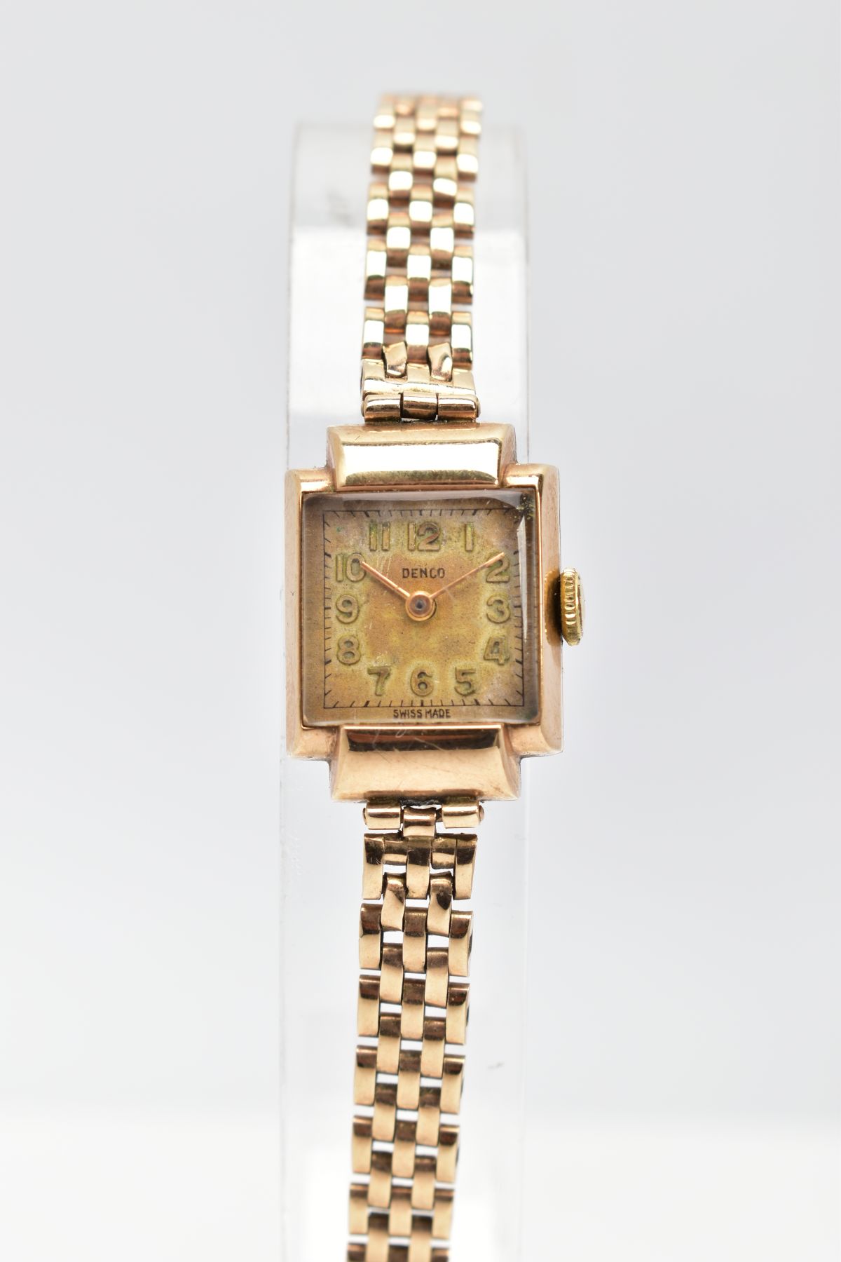 A LADY'S 9CT GOLD 'DENCO' WRISTWATCH, hand wound movement square discoloured dial signed 'Denco',