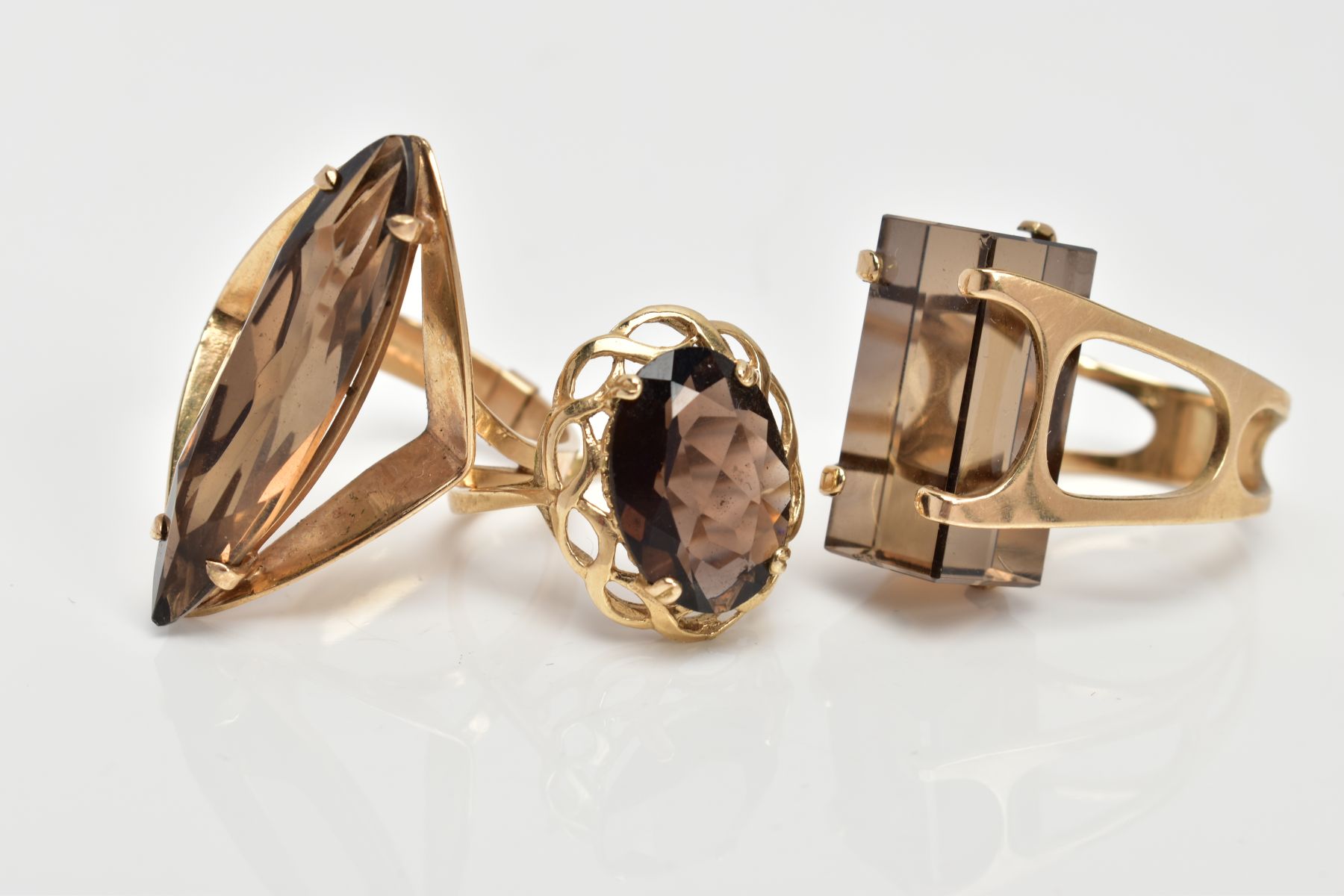 THREE 9CT GOLD SMOKEY QUARTZ DRESS RINGS, the first set with a rectangular cut Smokey quartz, - Image 2 of 3