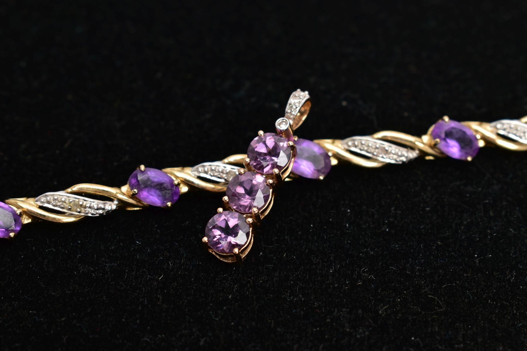 A 9CT GOLD AMETHYST AND DIAMOND LINE BRACELET AND PENDANT, the line bracelet set with ten oval cut - Image 5 of 5