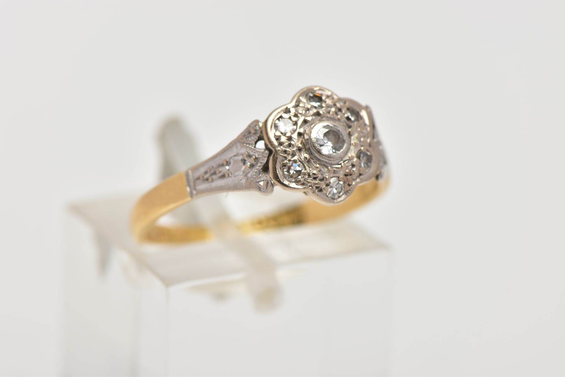 AN 18CT GOLD AND PLATINUM DIAMOND CLUSTER RING, the cluster of a flower shape, set with a central - Image 4 of 4