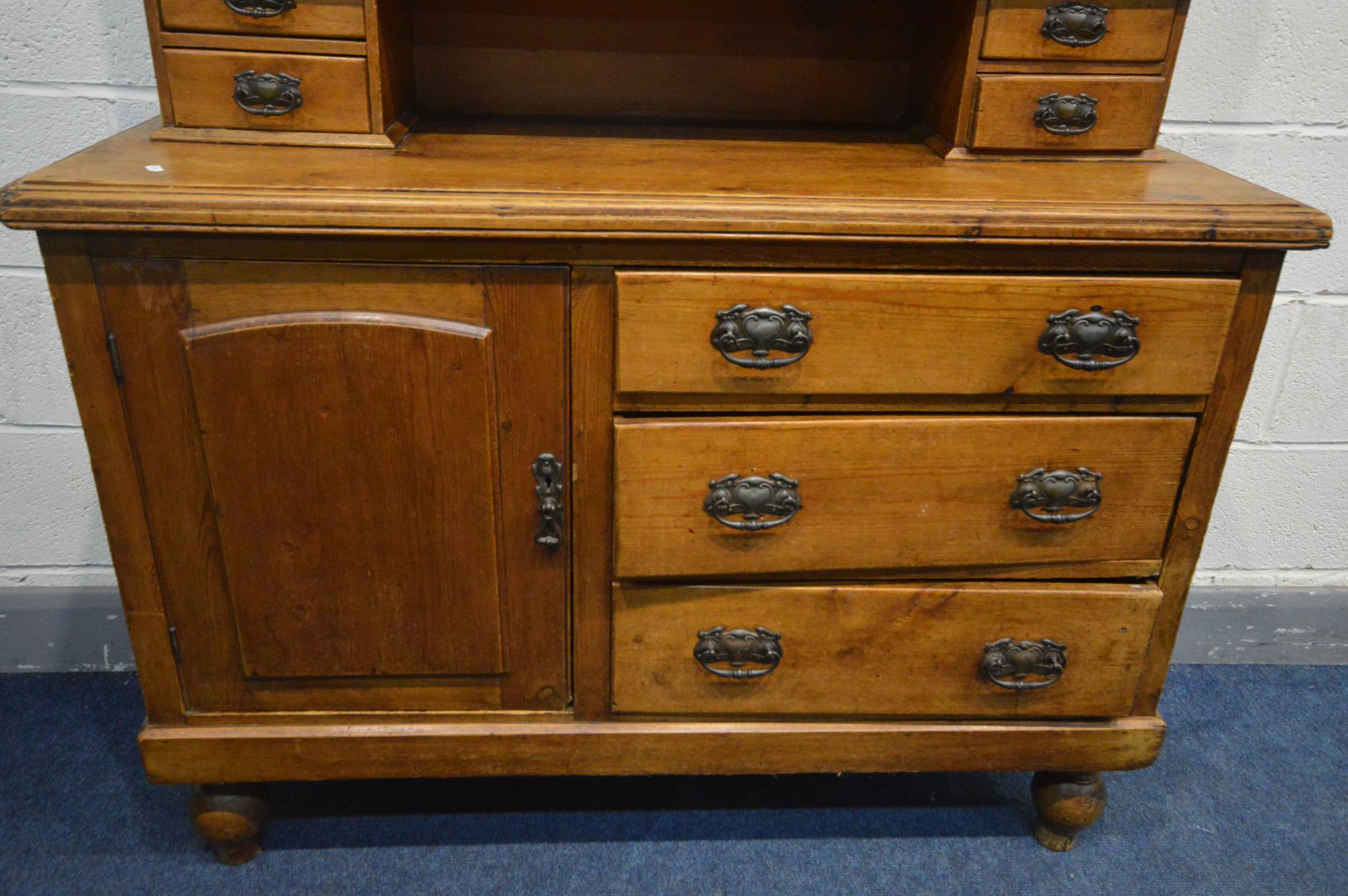 A LATE VICTORIAN PINE SIDEBOARD with a later glazed bookcase top, an arrangement of drawers and a - Image 3 of 3