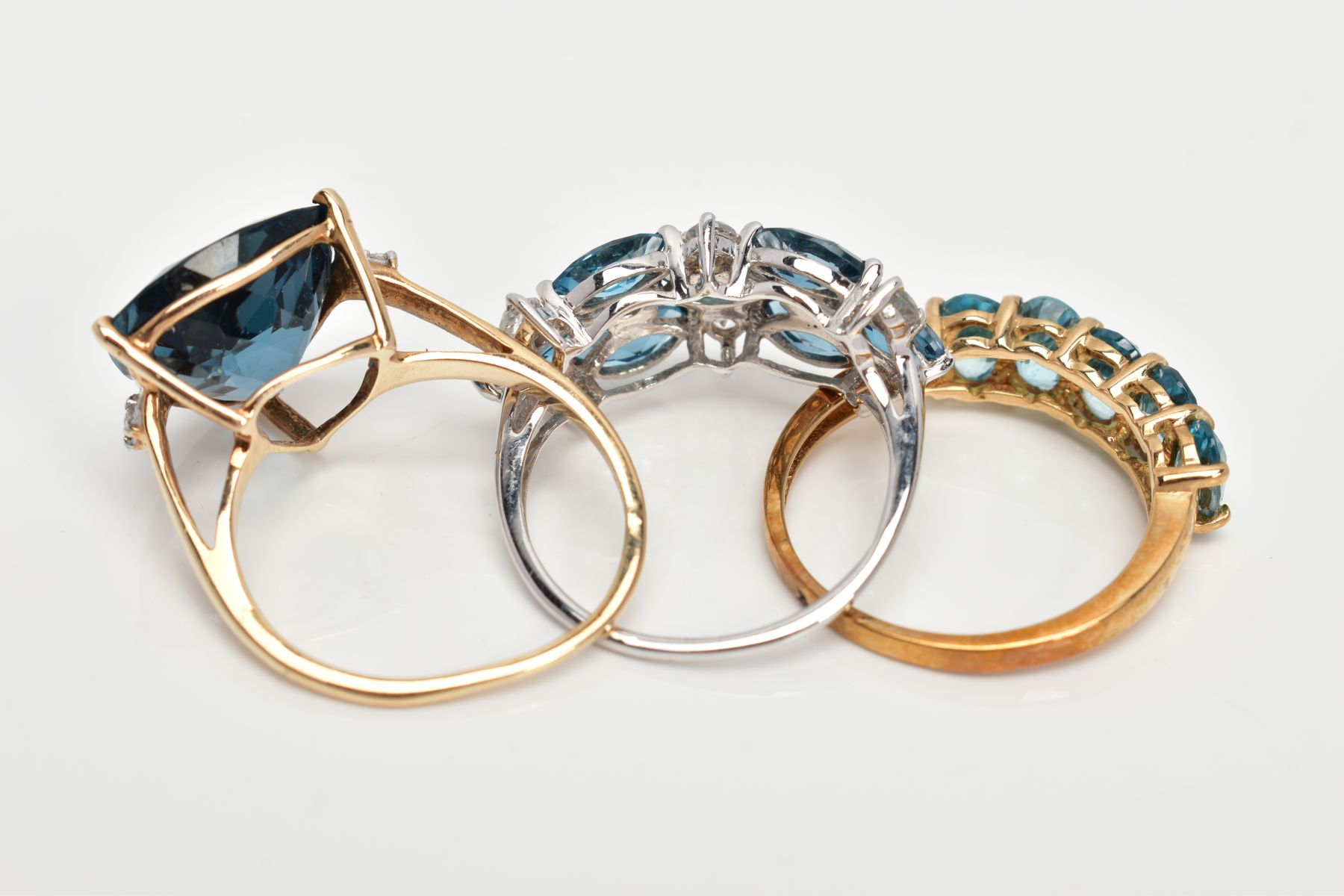 THREE 9CT GOLD GEM SET DRESS RINGS, the first a 9ct white gold ring set with blue and colourless - Image 3 of 3