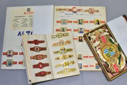 A COLLECTION OF VINTAGE CIGAR BANDS, mainly Dutch, stuck in two albums, with a quantity of loose