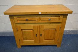 A LIGHT SOLID OAK SIDEBOARD, with two drawers, above fielded panel doors, width 108cm x depth 49cm