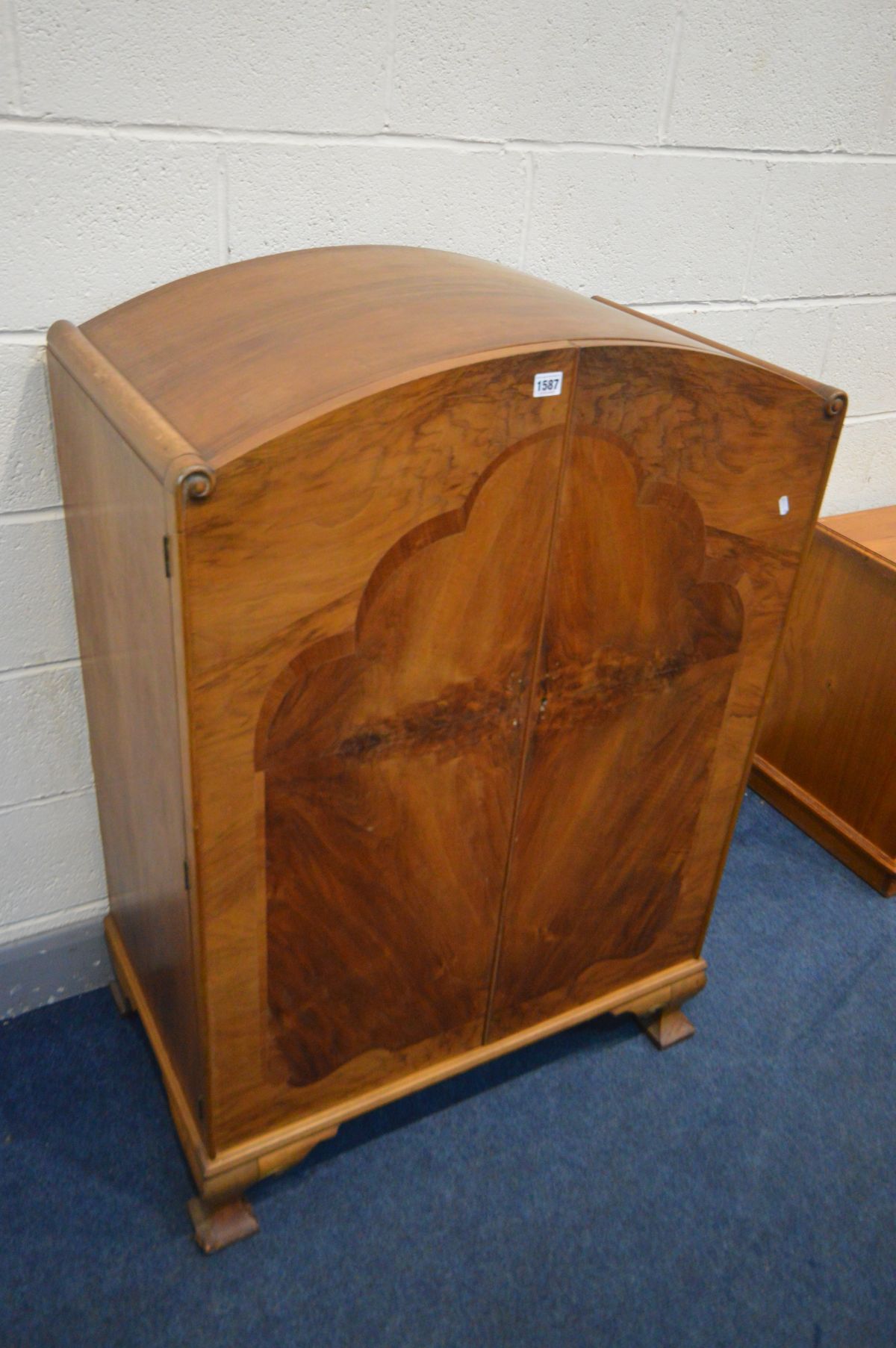 AN ART DECO WALNUT TWO DOOR CUPBOARD, with two internal drawers, width 82cm x depth 49cm x height