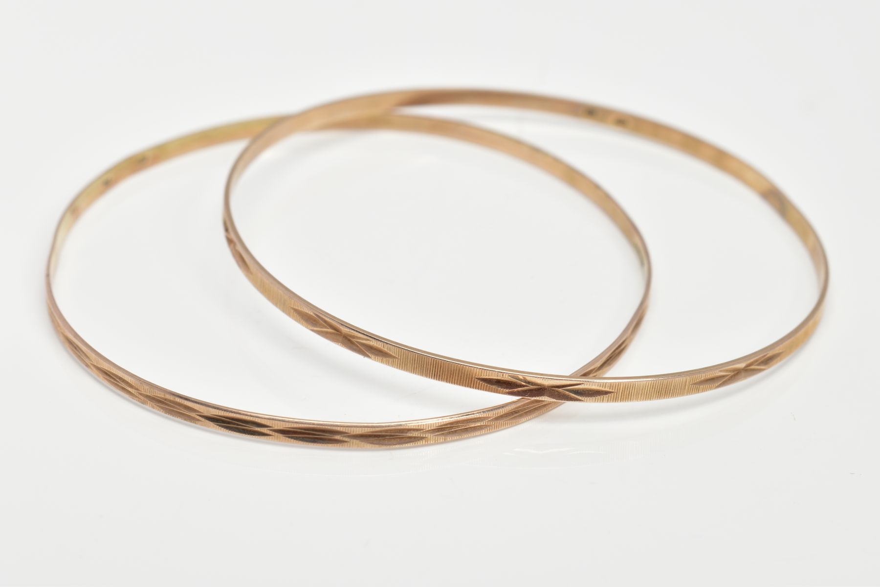 TWO 9CT GOLD THIN STACKING BANGLES, textured pattern, each hallmarked 9ct gold London import,
