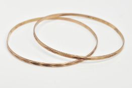 TWO 9CT GOLD THIN STACKING BANGLES, textured pattern, each hallmarked 9ct gold London import,