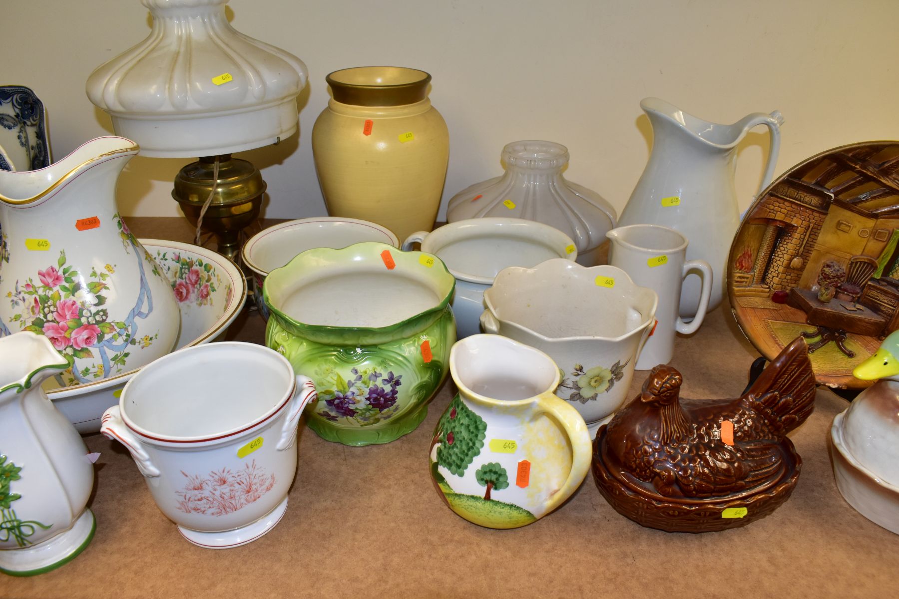 A GROUP OF JUGS, PLANTERS, LAMPS, ETC, to include a converted brass oil lamp with shade and chimney,