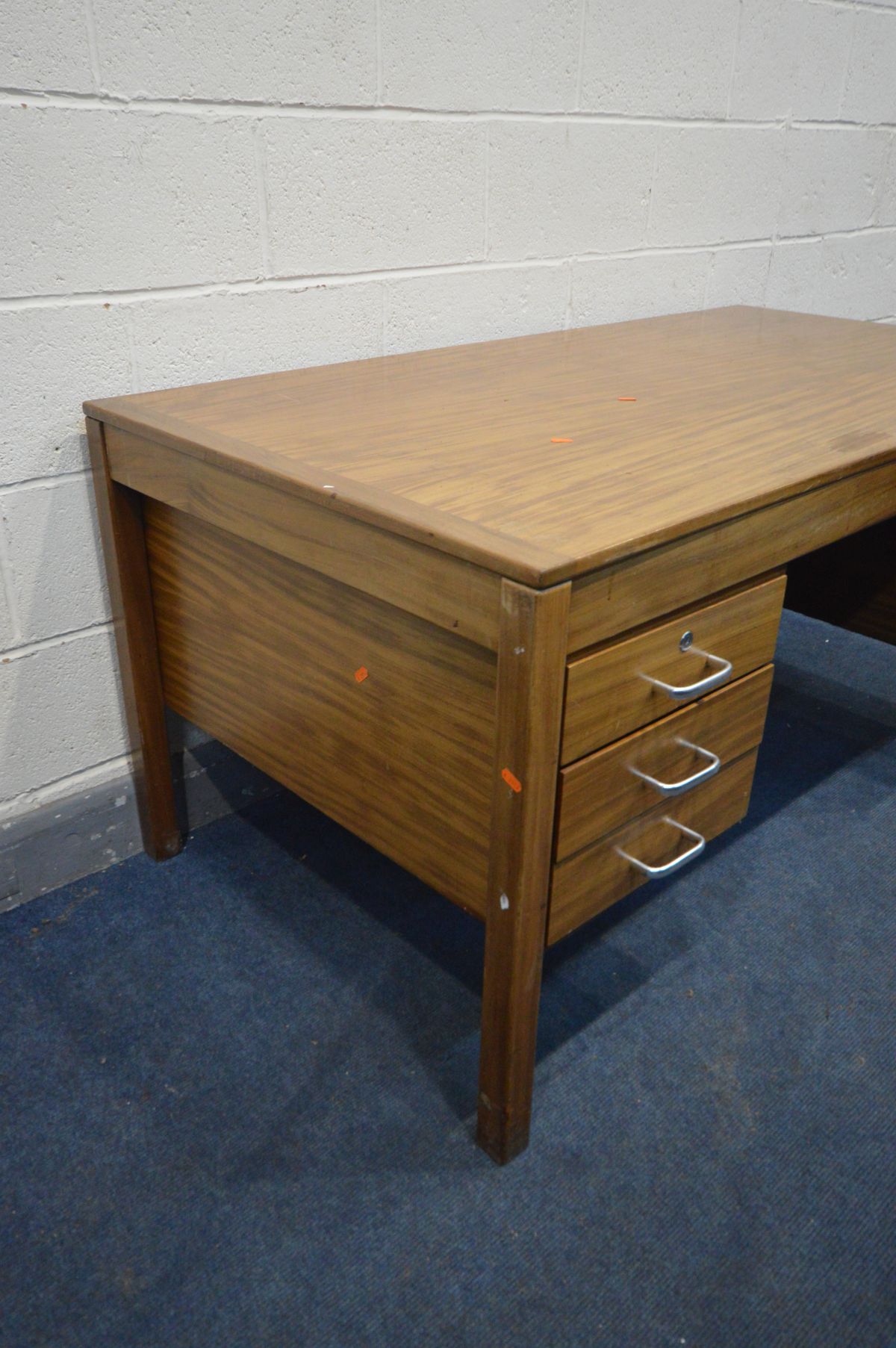 A MID 20TH CENTURY TEAK OFFICE DESK, a bank of three drawers and deep drawer opposing, width 153cm x - Image 2 of 2