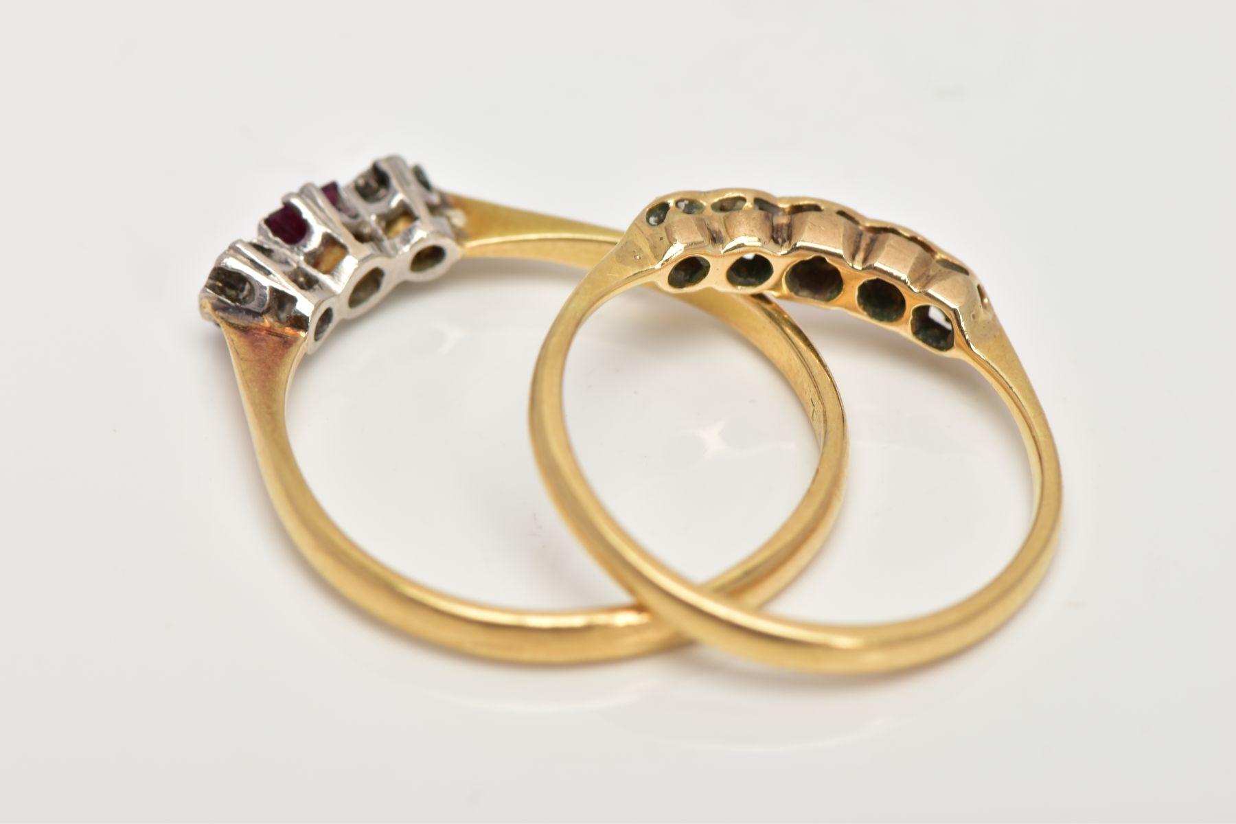 TWO YELLOW METAL DIAMOND RINGS, the first a three stone ring set with a central square cut ruby, - Image 3 of 3